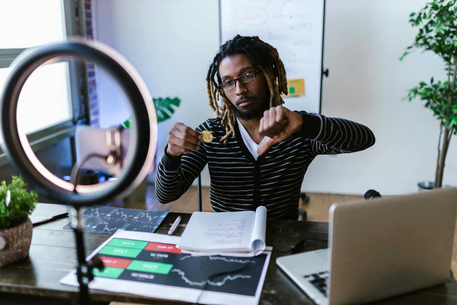 Adult man showing dislike for cryptocurrency investment while in a modern office setting.